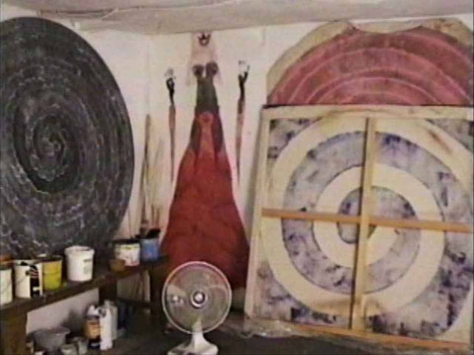 An artist’s studio with canvases, paints, tools